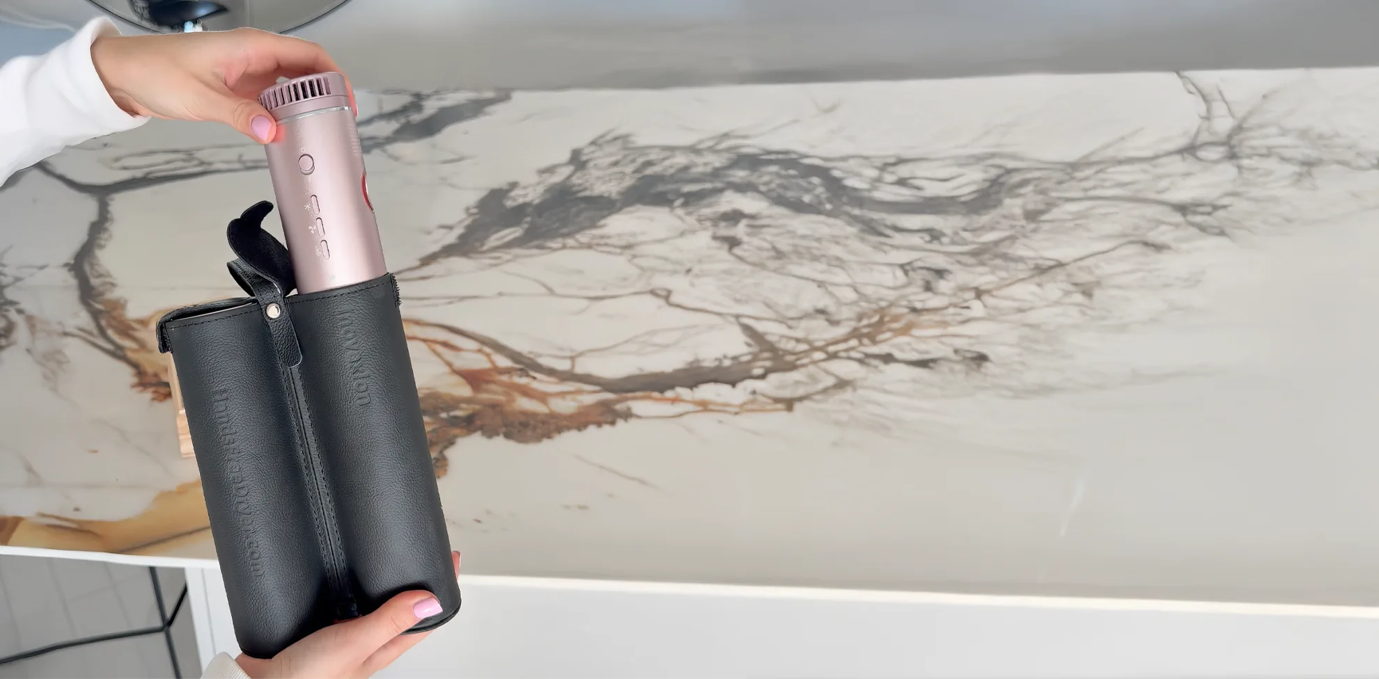 Travel-friendly automatic dryer with protective carrying pouch